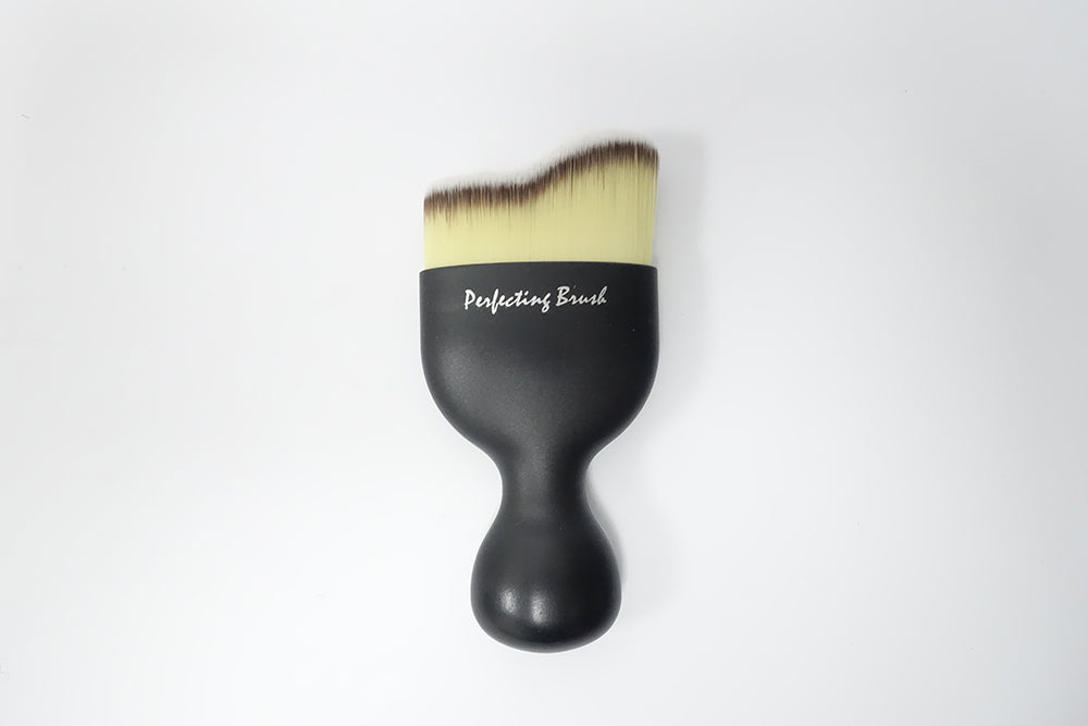 Makeup brush used to apply face powder, cream or liquid makeup.